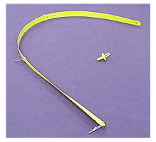 Removal of shipping strap from stacked laundry